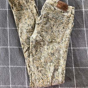 Level 99 yellow and olive ikat patterned jeans. 26